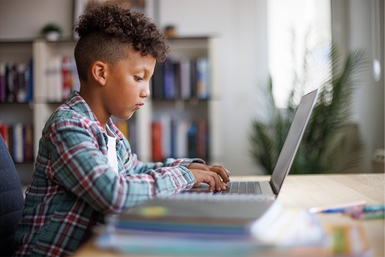 Child at computer coding