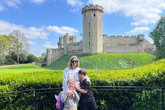 FAMILY OUTSIDE WARWICK CASTLE