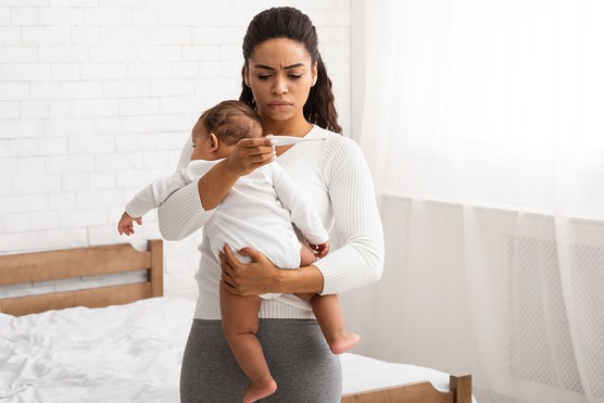 mum taking baby's temperature