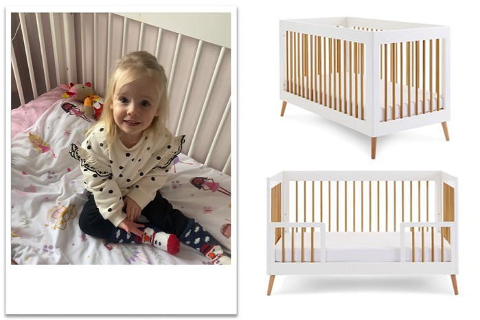 child sitting in Obaby Maya Cot bed in toddler bed mode