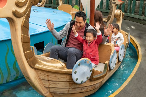 A father and son on Sea Dragons rides