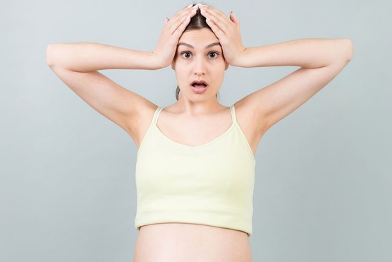 pregnant woman surprised by the hair growth on her bump