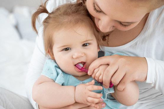baby brushing teeth
