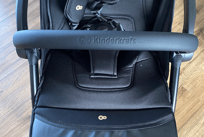 Close-up of Kinderkraft Apino pushchair bumper bar and seat unit