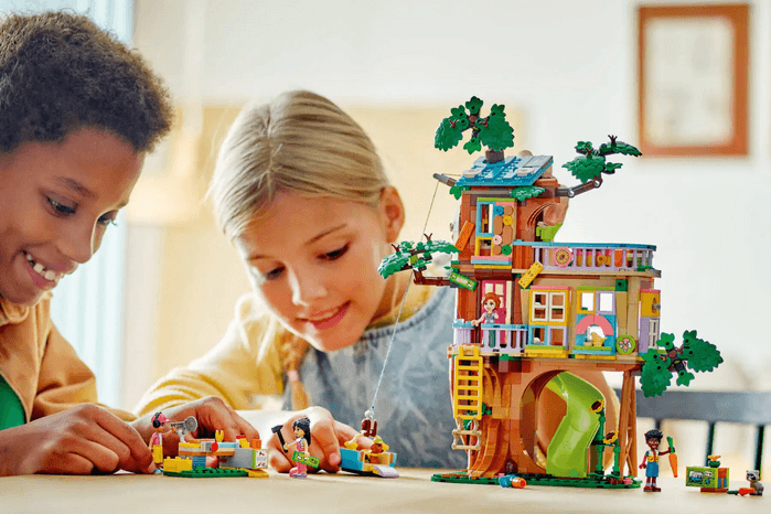 Friendship_Tree_House_Hangout children playing with LEGO Friendship tree set