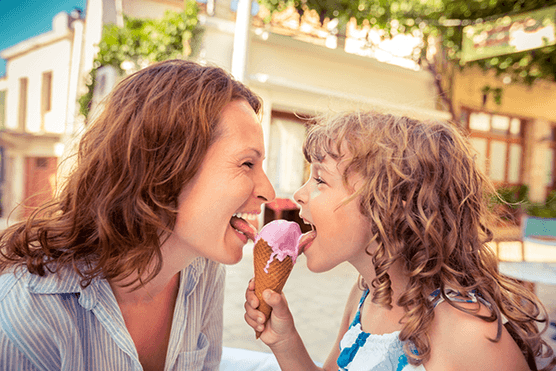 Mum and daughter sharing an ice cream
